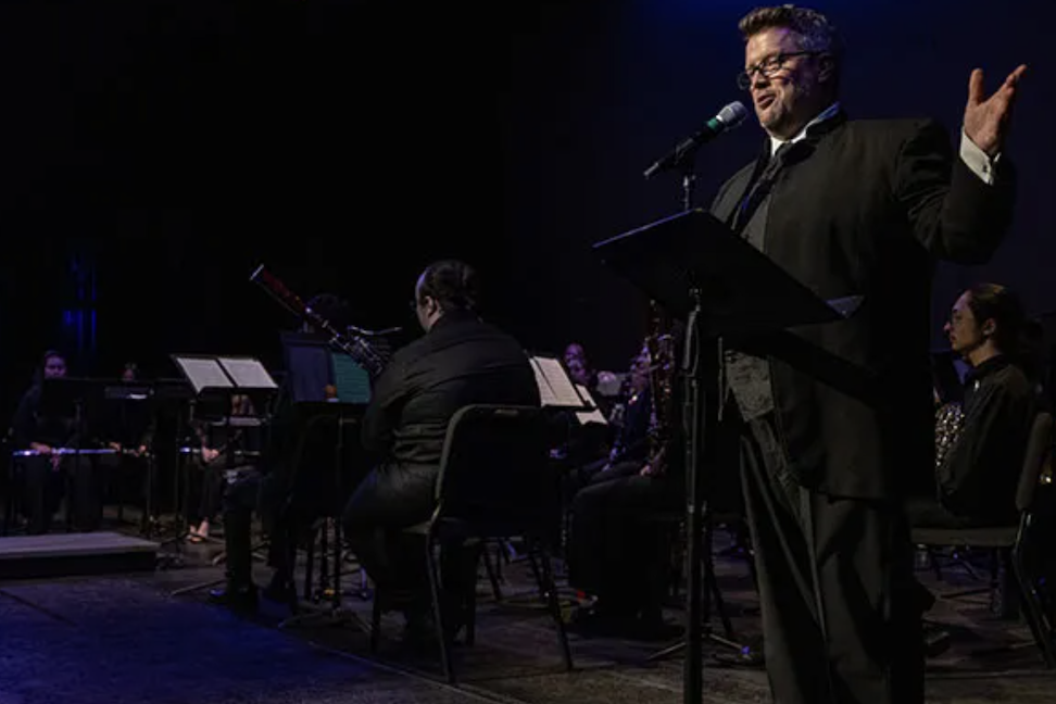 conductor and musicians in the background
