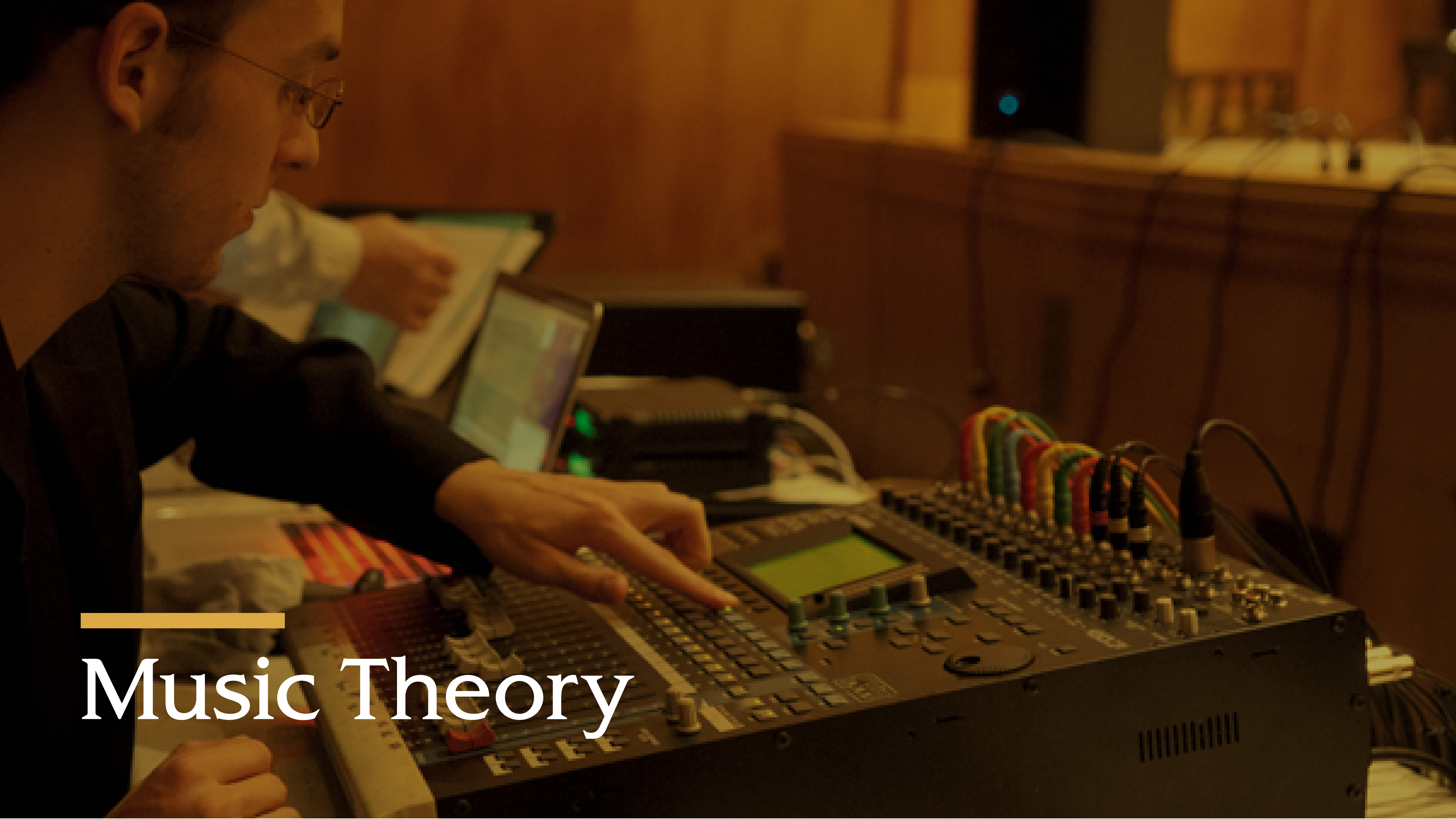 Music Theory text with a man changing dials on a machine