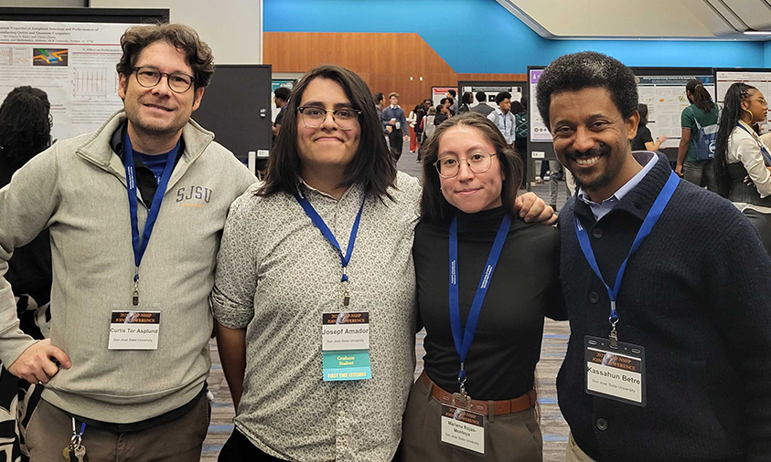 Group photo of Curtis Asplund, Josepf Amador, Mariana Rojas-Montoya, and Kassahun Betre at the San Jose Convention Center.
